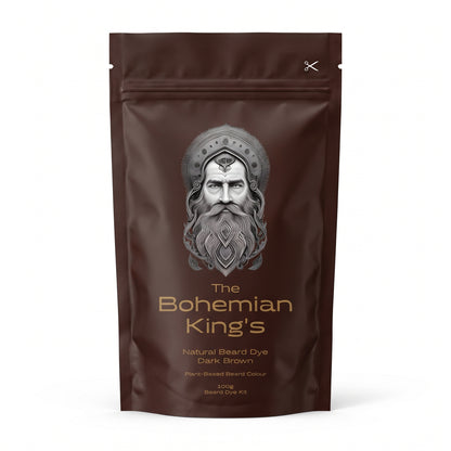 A dark brown stand-up pouch of 'The Bohemian King's' Natural Beard Dye in Dark Brown, featuring a detailed silver illustration of a bearded king on the front. Plant -Based Beard Dye